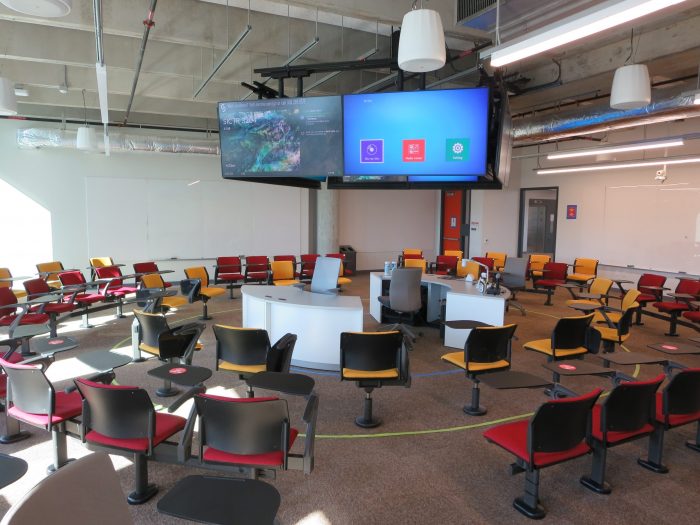 university classroom with large visual display screens