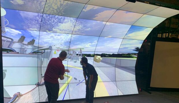 Two individuals immersive visualization display system with 35 2D- and 3D-capable flat panels in the shape of a cresting wave